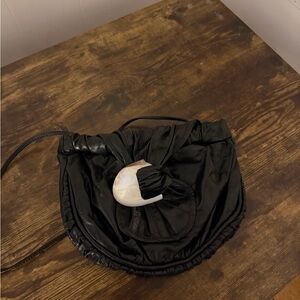 Black Shoulder Bag with White Shell Accent